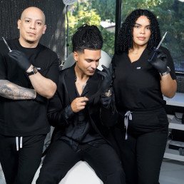 02 69 Three people in a beauty salon hold aesthetic tools